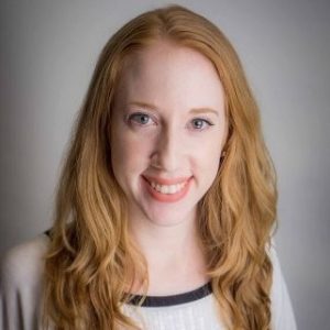 Pic of Brianna Miller smiling with long red hair