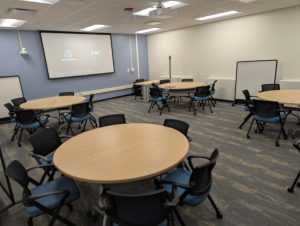 Pic tables and chairs and projector in Van Hise room 294